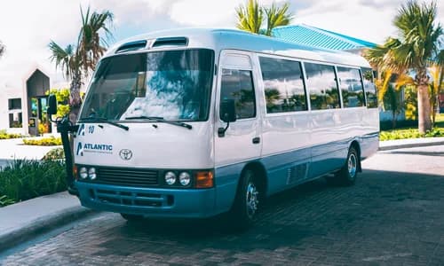 Resort shuttle bus transporting large groups of hotel guests